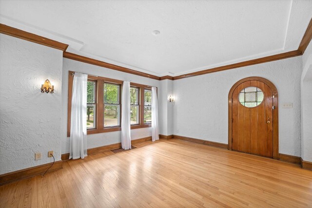 2767 S Herman St, Milwaukee, WI 53207 - empty room featuring a textured wall, light wood-style flooring, and ornamental molding