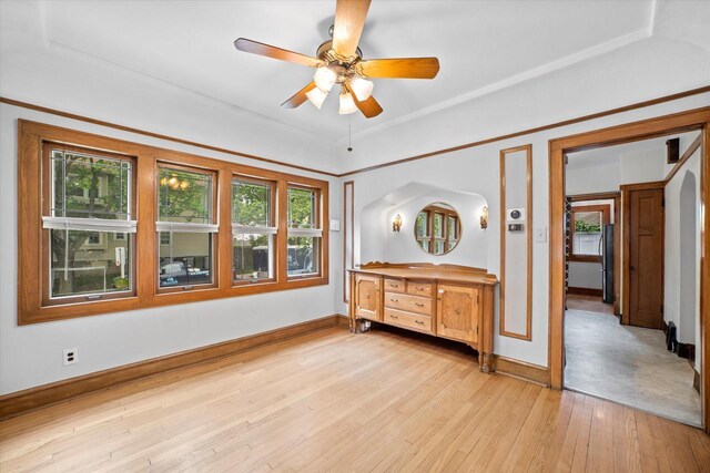 2767 S Herman St, Milwaukee, WI 53207 - unfurnished bedroom with multiple windows, light wood-type flooring, freestanding refrigerator, and arched walkways