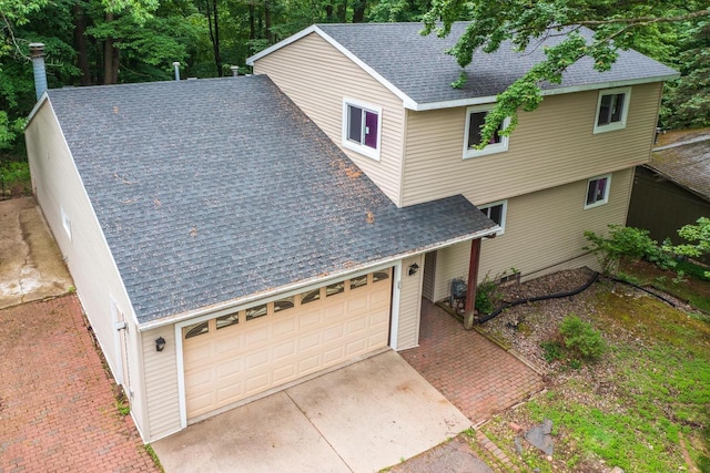 1705 Stark St, Wausau, WI 54403 - view of front of house with a garage and a shingled roof