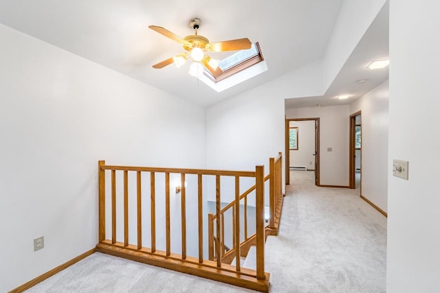 1705 Stark St, Wausau, WI 54403 - hall featuring an upstairs landing, a skylight, carpet flooring, vaulted ceiling, and baseboard heating