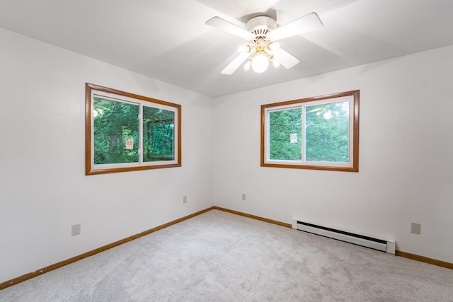 1705 Stark St, Wausau, WI 54403 - carpeted empty room featuring baseboard heating and a ceiling fan