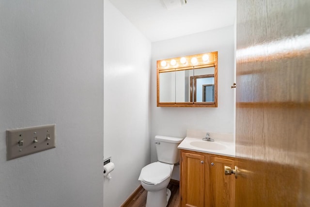 1705 Stark St, Wausau, WI 54403 - half bathroom featuring vanity and wood finished floors