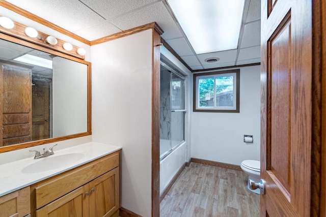 1705 Stark St, Wausau, WI 54403 - bathroom featuring vanity, wood finished floors, a drop ceiling, and tub / shower combination
