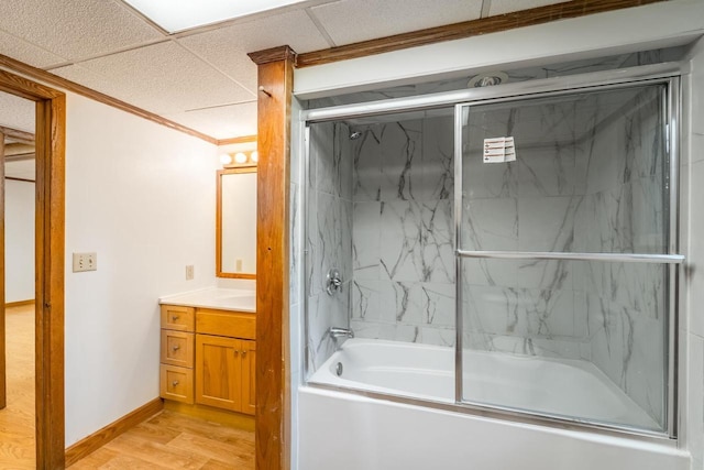 1705 Stark St, Wausau, WI 54403 - bathroom featuring bath / shower combo with glass door, vanity, wood finished floors, and ornamental molding