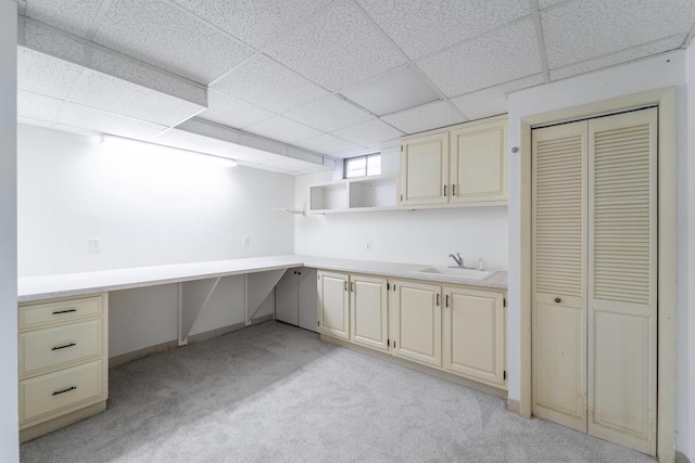 1705 Stark St, Wausau, WI 54403 - kitchen with light carpet, cream cabinets, a paneled ceiling, light countertops, and open shelves