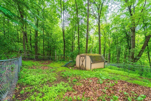 1705 Stark St, Wausau, WI 54403 - fenced backyard featuring a shed and a forest view