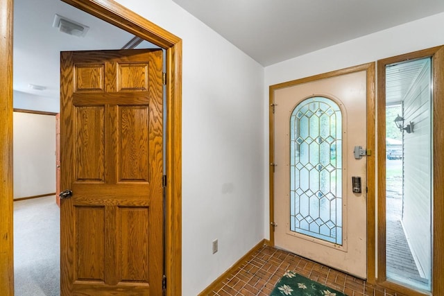 1705 Stark St, Wausau, WI 54403 - foyer entrance featuring baseboards and brick patterned floors