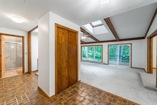 1705 Stark St, Wausau, WI 54403 - unfurnished living room featuring a skylight, a baseboard radiator, and beam ceiling