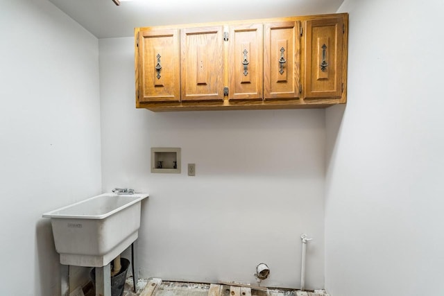 1705 Stark St, Wausau, WI 54403 - laundry area with washer hookup and cabinet space