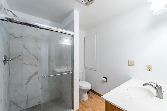 1705 Stark St, Wausau, WI 54403 - full bath with a marble finish shower, vanity, and wood finished floors