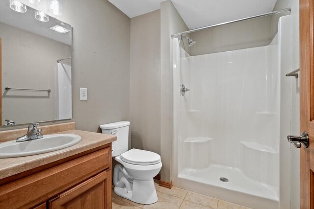 1106 Lake Largo Dr, Green Bay, WI 54311 - full bathroom featuring tile patterned floors, vanity, and a shower