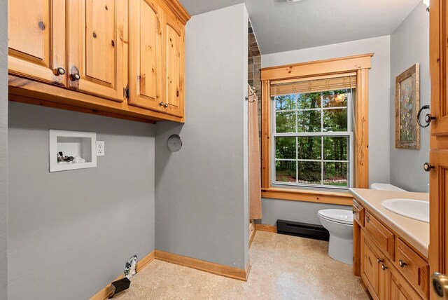 N5730 Parkway Rd, Pound, WI 54161 - washroom with a baseboard radiator and washer hookup