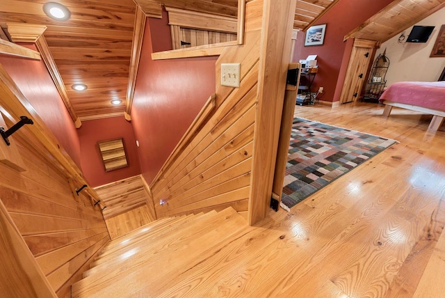 N5730 Parkway Rd, Pound, WI 54161 - stairs with wood ceiling, wood finished floors, ornamental molding, and wooden walls