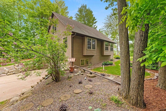 N5730 Parkway Rd, Pound, WI 54161 - view of side of home featuring roof with shingles