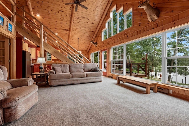 N5730 Parkway Rd, Pound, WI 54161 - carpeted living room featuring wooden walls, high vaulted ceiling, a ceiling fan, and wood ceiling