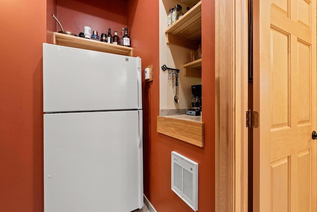 N5730 Parkway Rd, Pound, WI 54161 - kitchen featuring freestanding refrigerator and open shelves