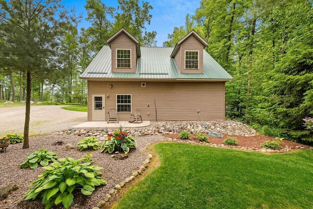 N5730 Parkway Rd, Pound, WI 54161 - rear view of property with a metal roof, a yard, and a patio area