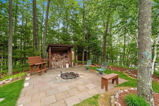 N5730 Parkway Rd, Pound, WI 54161 - view of patio featuring an outdoor fire pit
