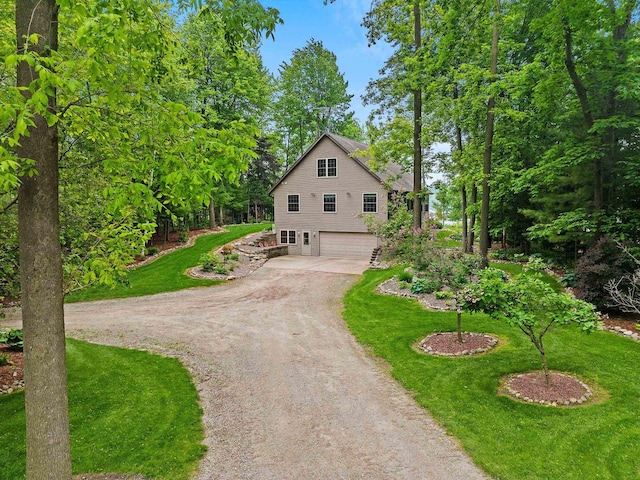 N5730 Parkway Rd, Pound, WI 54161 - view of front of property featuring driveway, a garage, and a front lawn