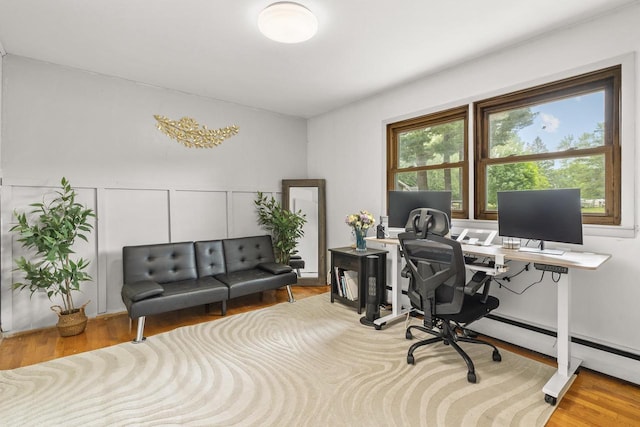 551 Market Ave, Port Edwards, WI 54469 - office featuring wood finished floors and a baseboard radiator