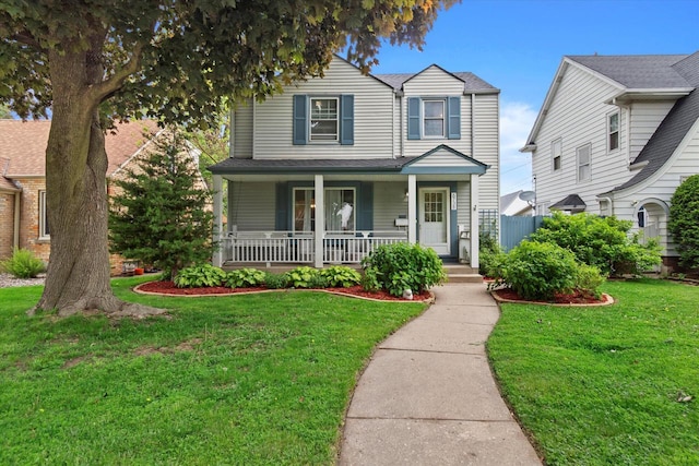 6738 W Monona Pl, West Allis, WI 53219 - traditional-style house with a porch and a front yard