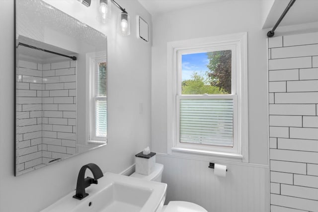 6738 W Monona Pl, West Allis, WI 53219 - full bathroom featuring a shower and a wainscoted wall
