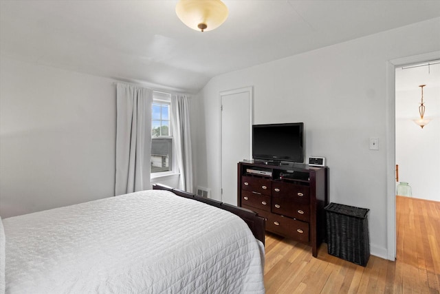 6738 W Monona Pl, West Allis, WI 53219 - bedroom featuring light wood-style floors and baseboards