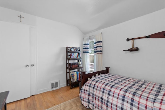 6738 W Monona Pl, West Allis, WI 53219 - bedroom featuring wood-type flooring and vaulted ceiling