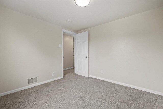 2225 Shoop St, Racine, WI 53404 - empty room featuring carpet flooring and baseboards
