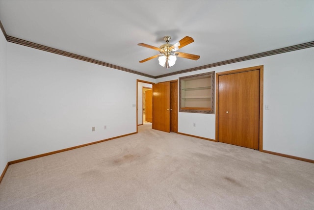 1819 Sumac Ct Unit A, Grafton, WI 53024 - unfurnished bedroom featuring light colored carpet, crown molding, ceiling fan, and two closets