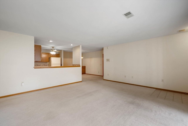 1819 Sumac Ct Unit A, Grafton, WI 53024 - unfurnished living room featuring light carpet, recessed lighting, and a ceiling fan
