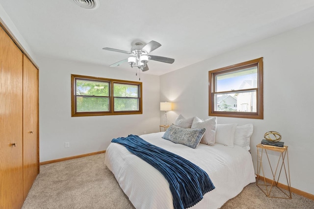 4326 Taylor Ave, Mount Pleasant, WI 53405 - bedroom with multiple windows, light colored carpet, and a closet