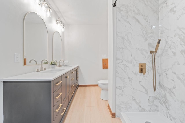 4326 Taylor Ave, Mount Pleasant, WI 53405 - bathroom with double vanity, a marble finish shower, and wood finished floors
