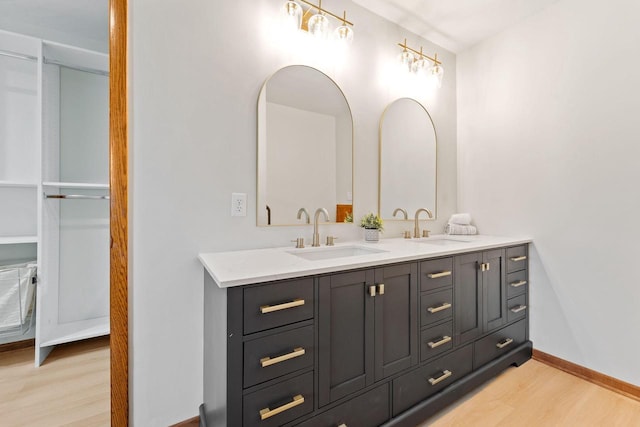 4326 Taylor Ave, Mount Pleasant, WI 53405 - bathroom featuring wood finished floors and double vanity