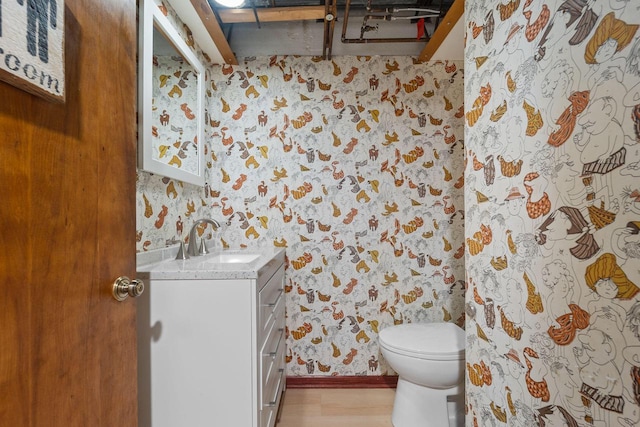 4326 Taylor Ave, Mount Pleasant, WI 53405 - bathroom featuring wallpapered walls, vanity, and wood finished floors