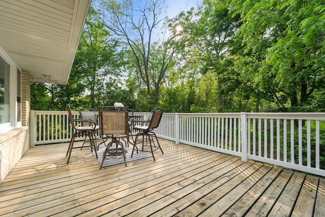4326 Taylor Ave, Mount Pleasant, WI 53405 - wooden terrace with outdoor dining area and view of wooded area