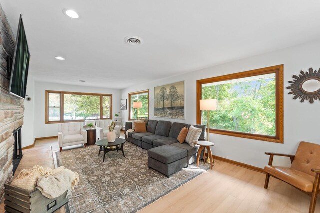 4326 Taylor Ave, Mount Pleasant, WI 53405 - living area with a stone fireplace, wood finished floors, and recessed lighting