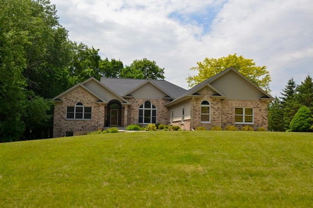 551 Bayberry Ln, Slinger, WI 53086 - single story home featuring a front yard and brick siding