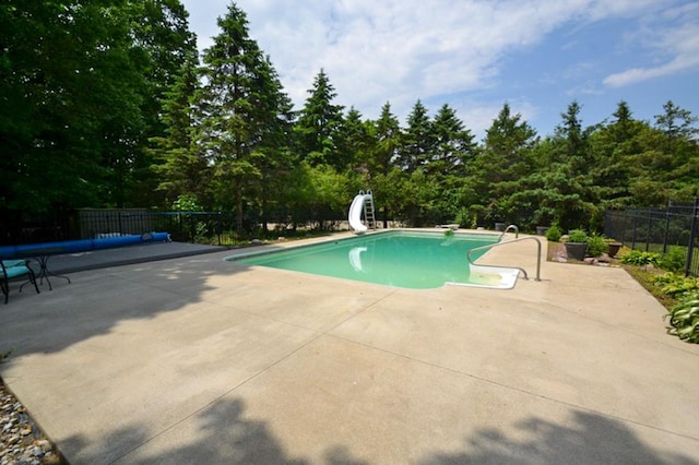 551 Bayberry Ln, Slinger, WI 53086 - view of pool featuring a water slide and a patio