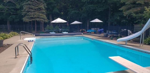 551 Bayberry Ln, Slinger, WI 53086 - view of swimming pool with a water slide and a diving board