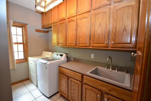 551 Bayberry Ln, Slinger, WI 53086 - washroom with cabinet space, washing machine and clothes dryer, and light tile patterned floors