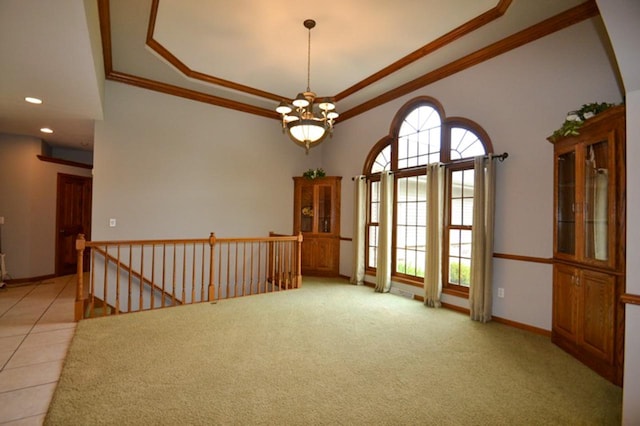551 Bayberry Ln, Slinger, WI 53086 - unfurnished room featuring a tray ceiling, crown molding, a chandelier, recessed lighting, and light carpet