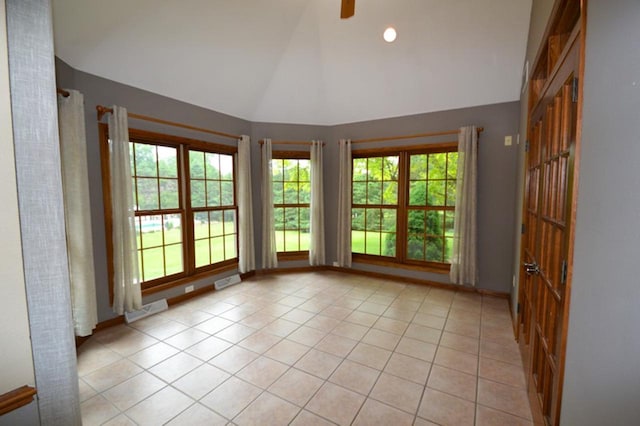 551 Bayberry Ln, Slinger, WI 53086 - spare room featuring plenty of natural light, light tile patterned flooring, ceiling fan, and high vaulted ceiling