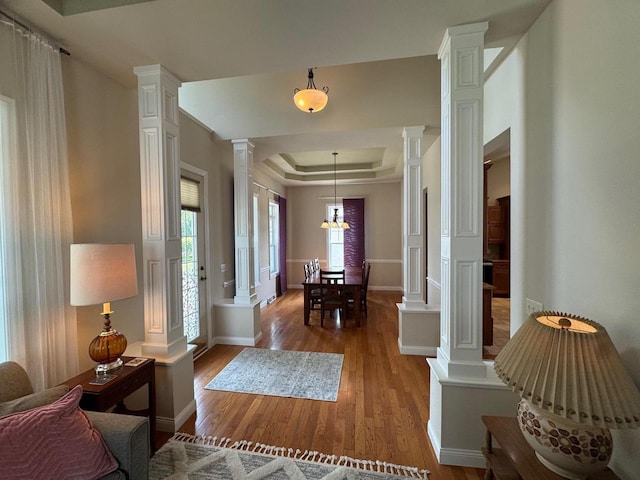 4126 Westerfield Ln, Madison, WI 53704 - entryway featuring decorative columns, wood finished floors, and a tray ceiling