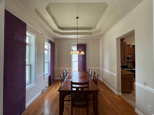 4126 Westerfield Ln, Madison, WI 53704 - dining area with a chandelier, healthy amount of natural light, and light wood-style flooring