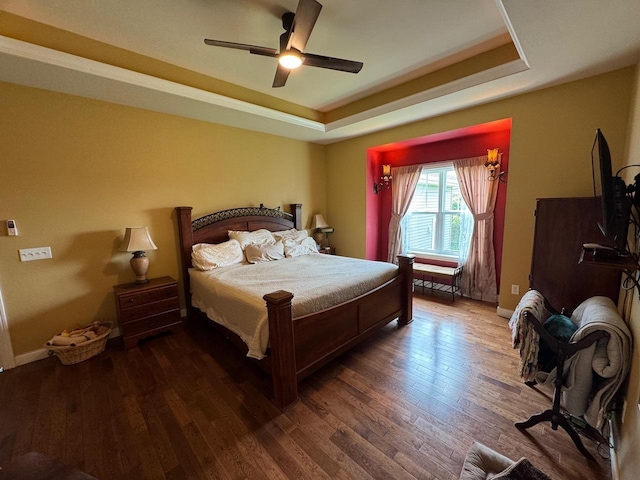 4126 Westerfield Ln, Madison, WI 53704 - bedroom with a tray ceiling, wood finished floors, and ceiling fan