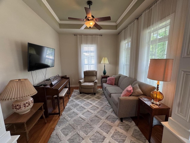 4126 Westerfield Ln, Madison, WI 53704 - living area featuring light wood-style floors, a raised ceiling, a ceiling fan, and ornamental molding