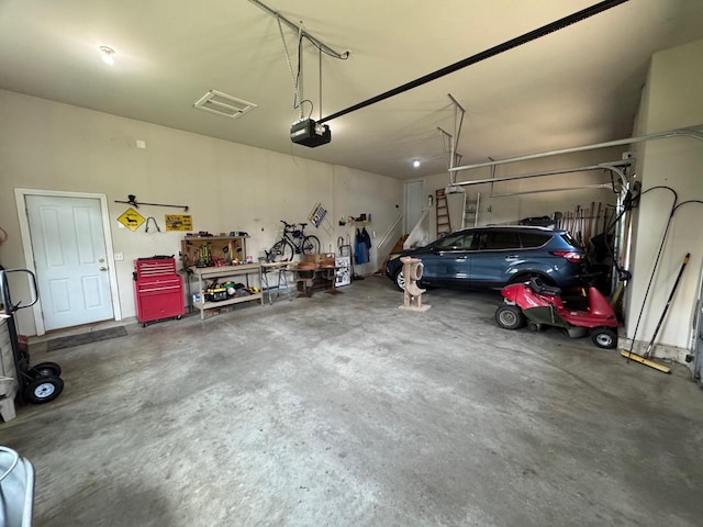 4126 Westerfield Ln, Madison, WI 53704 - garage with a garage door opener and a workshop area