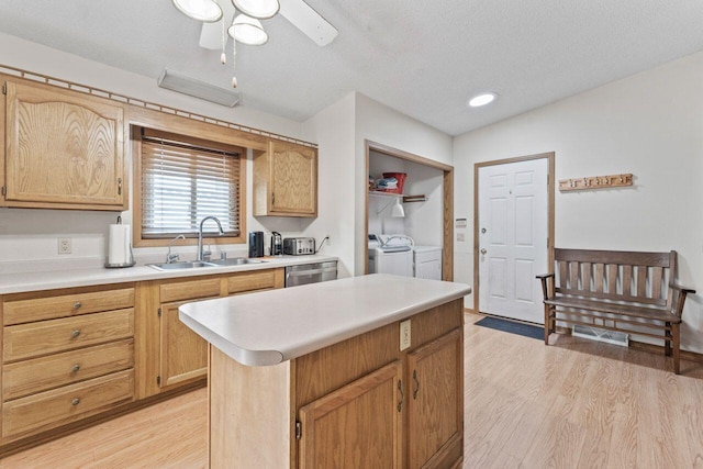 12129 221st Ave, Bristol, WI 53104 - kitchen with independent washer and dryer, light wood-type flooring, dishwasher, light countertops, and a textured ceiling