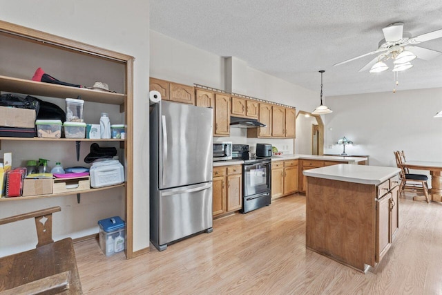 12129 221st Ave, Bristol, WI 53104 - kitchen featuring stainless steel appliances, under cabinet range hood, light wood-style floors, light countertops, and a ceiling fan